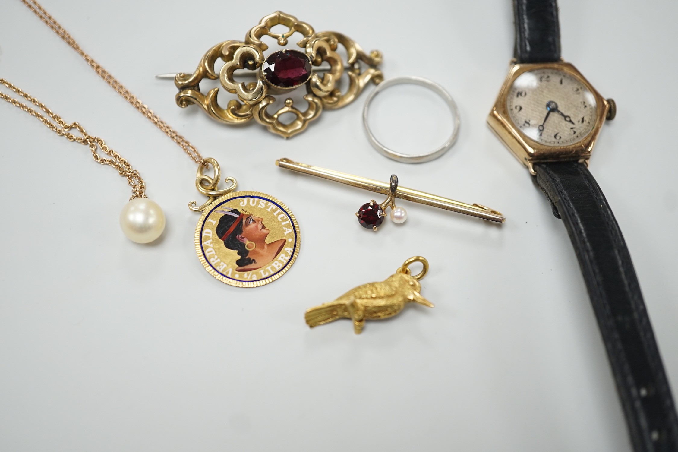 A platinum wedding band, 2.3 grams, a 9ct gold, garnet and seed pearl set bar brooch, a bird charm, a yellow metal and enamelled pendant on a 9ct chain, a 9ct and cultured pearl pendant necklace, a lady's 9ct gold hexago
